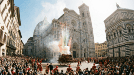 Fireworks during the Scoppio del Carro Easter tradition in Florence, with the Cathedral of Santa Maria del Fiore and the Baptistery in Piazza del Duomo.