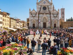 Spring festival in Florence with musicians and flag throwers performing in Piazza Santa Croce, surrounded by flower stalls and a large crowd in front of the Basilica of Santa Croce.