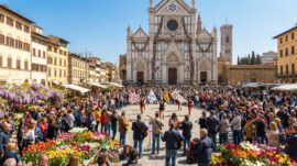 Spring festival in Florence with musicians and flag throwers performing in Piazza Santa Croce, surrounded by flower stalls and a large crowd in front of the Basilica of Santa Croce.