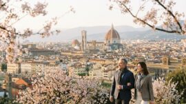 Panoramic spring view of Florence from Piazzale Michelangelo with the Duomo and blooming trees at sunset